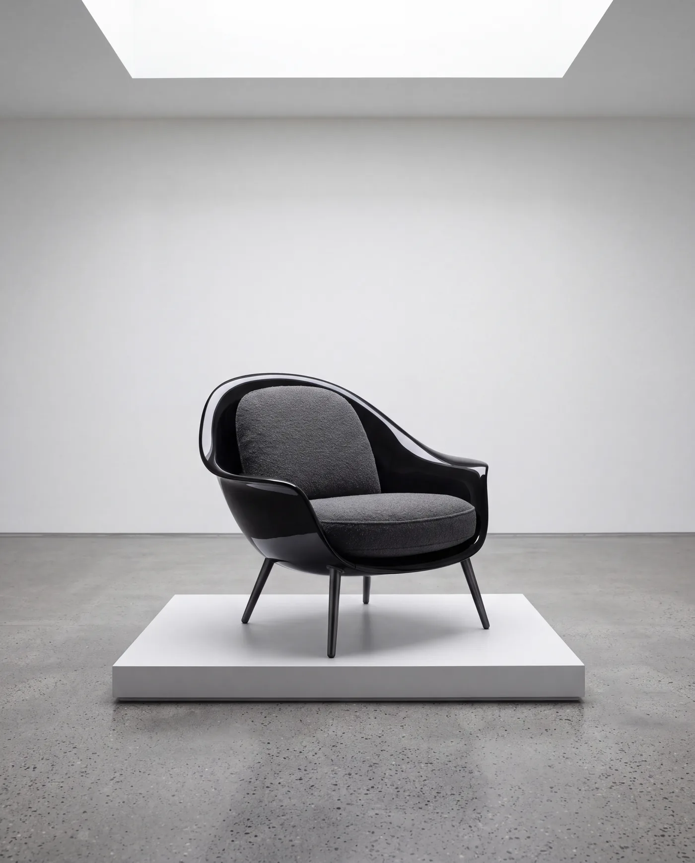 Dune in black lacquer on a white plinth in a gallery