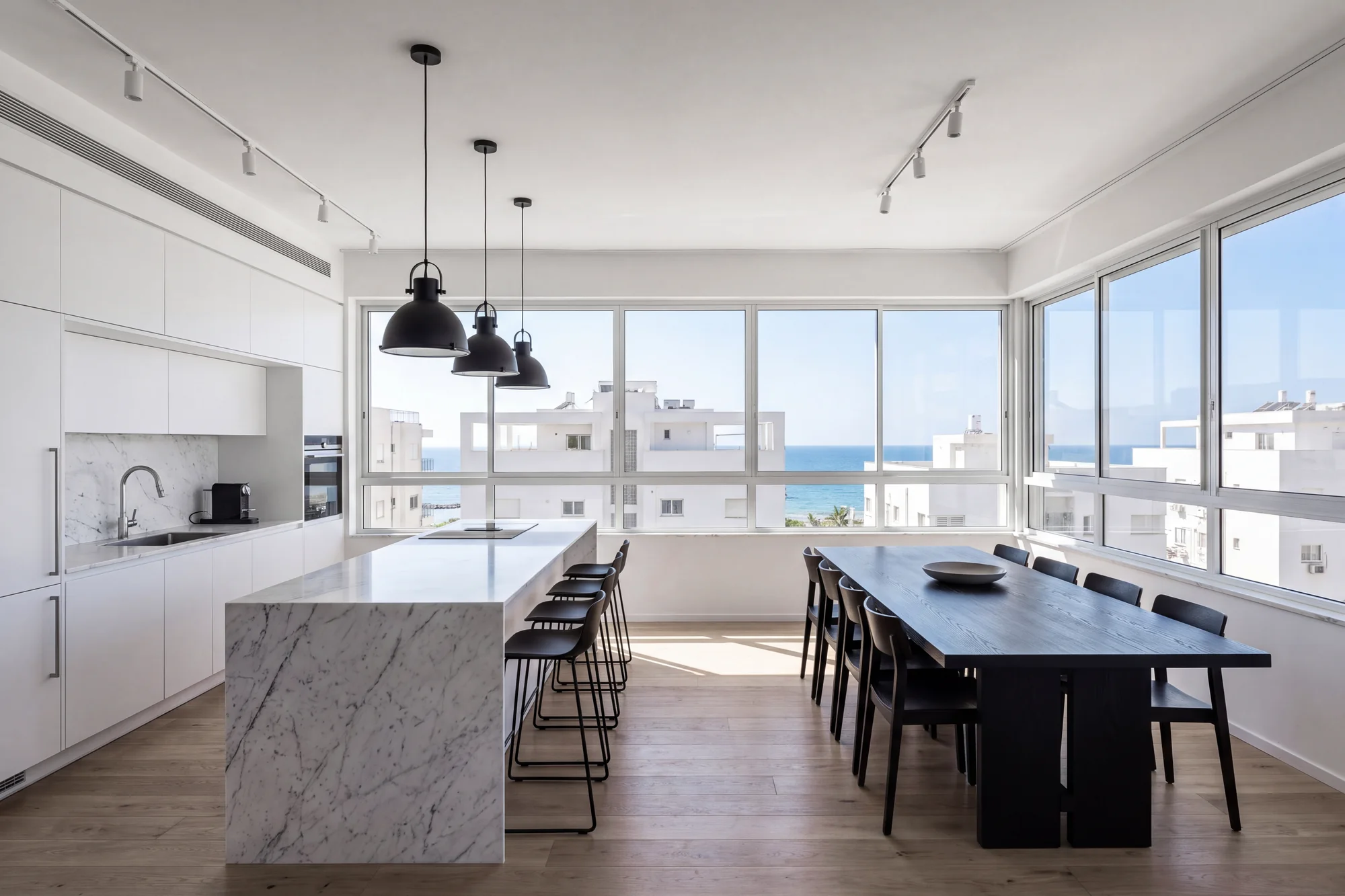 Living and dining room of a three bedroom residence