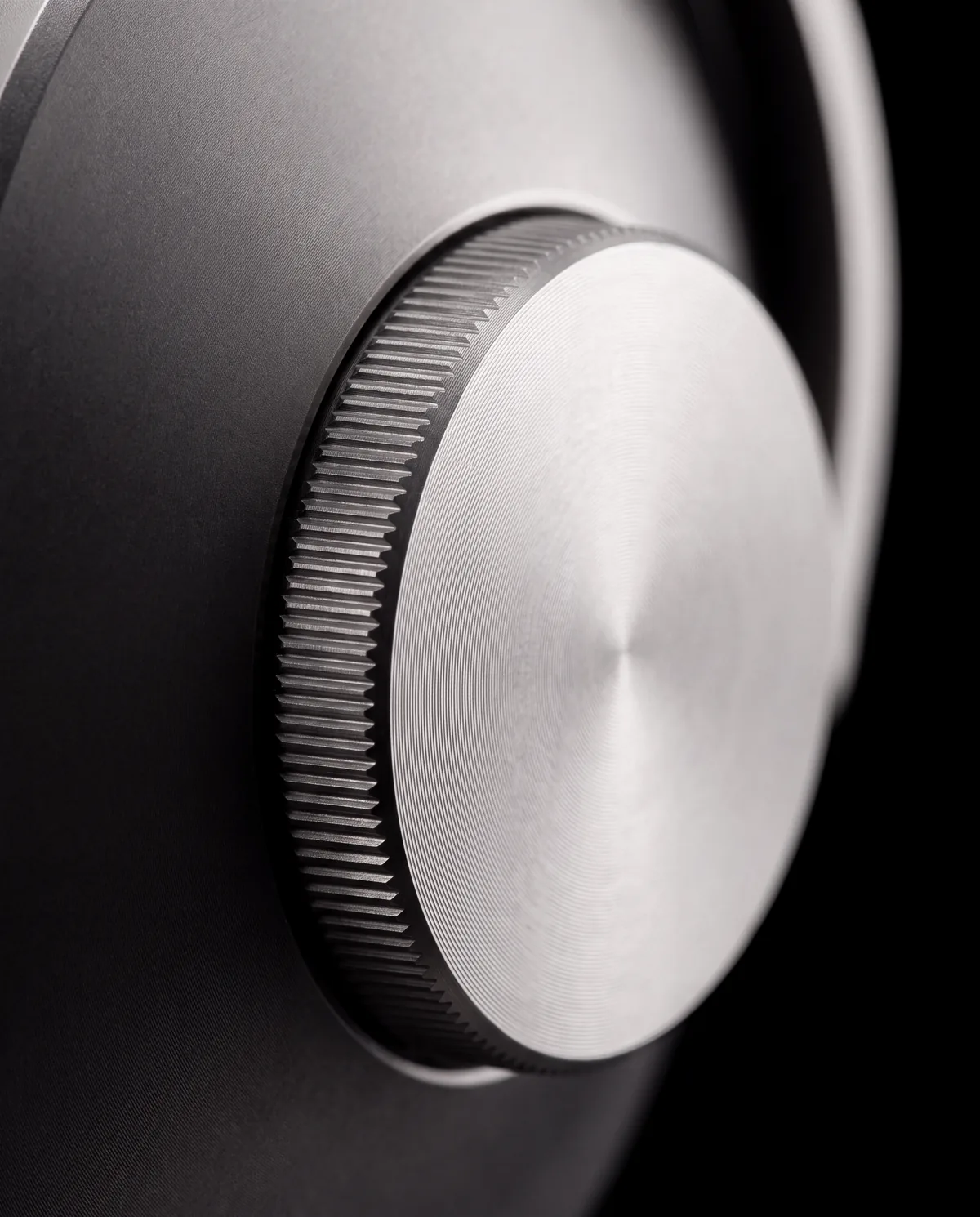 Macro of the knurled titanium dial