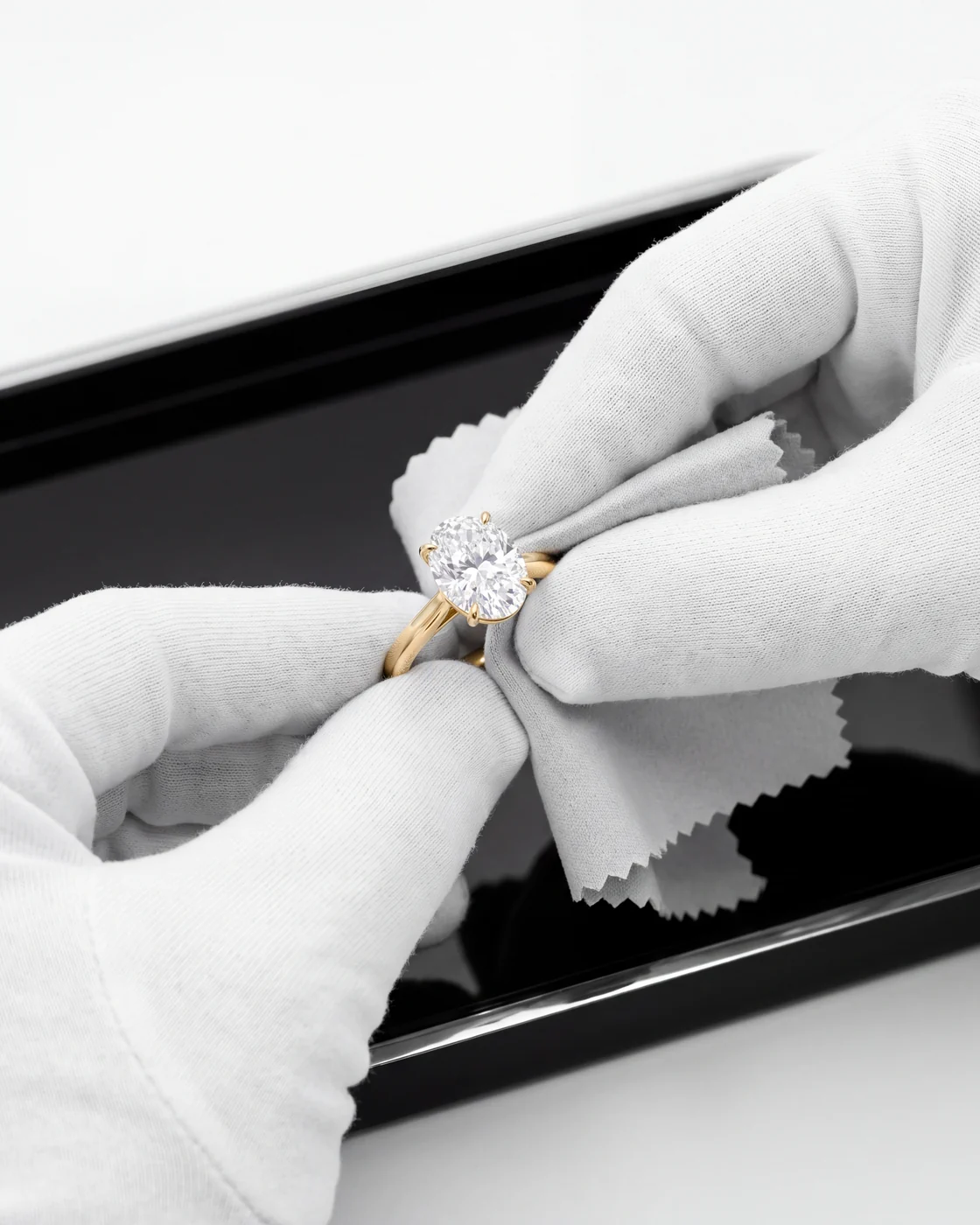 A jeweller polishing a ring