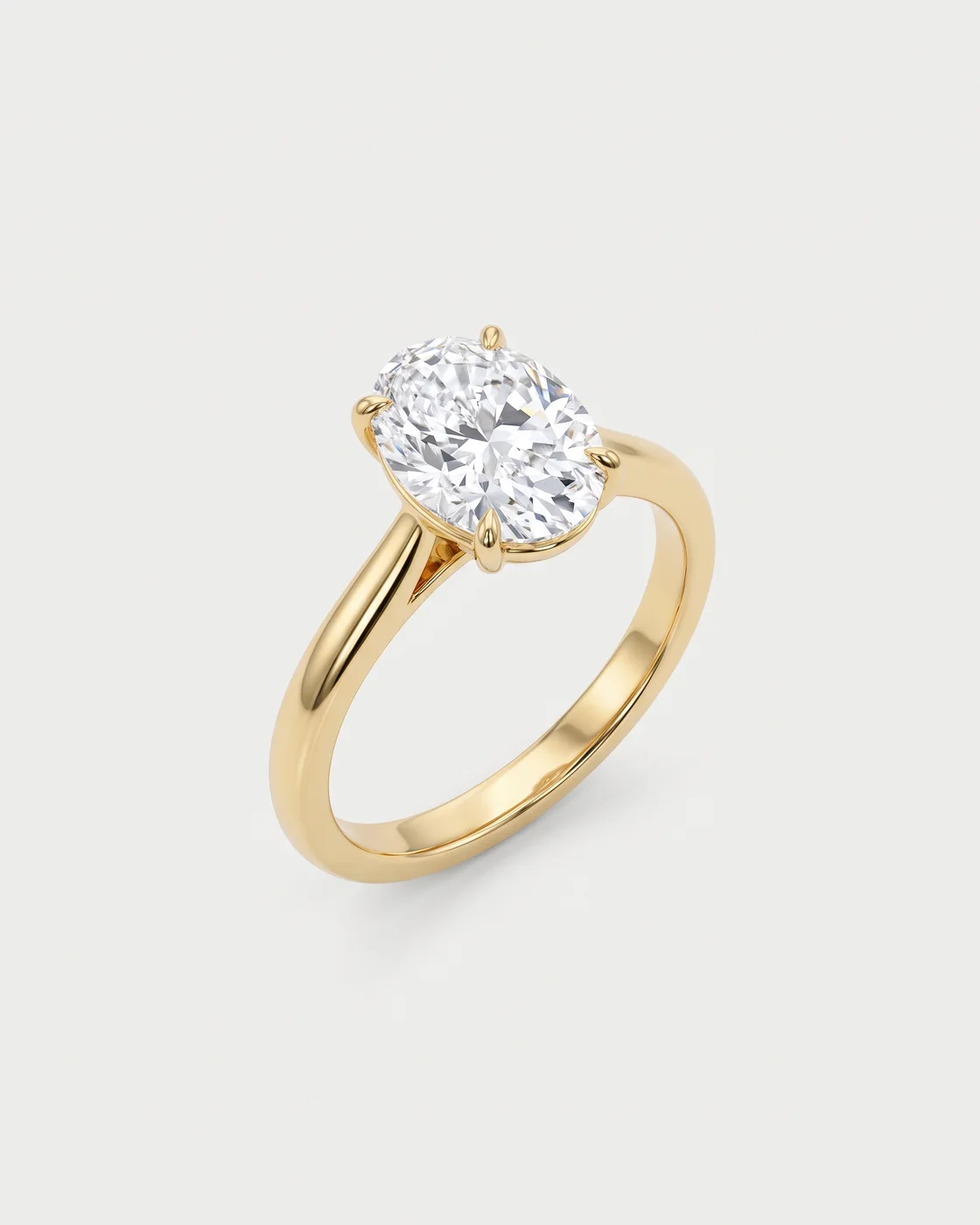 Soleil solitaire ring in 18k yellow gold with an oval diamond