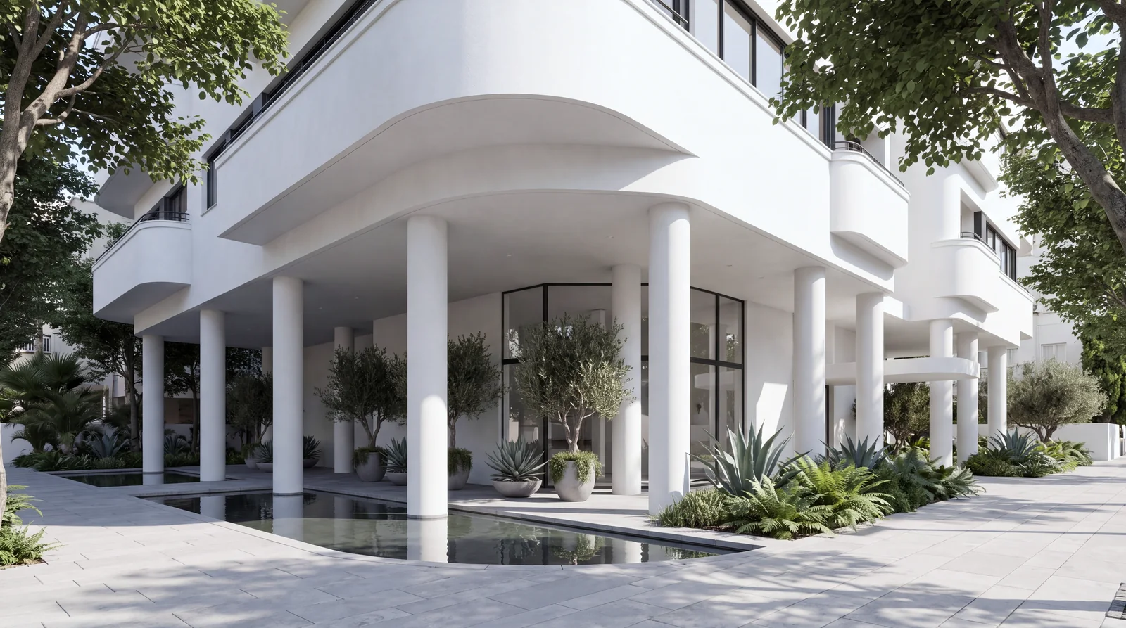 Street-level view of the white pilotis and the garden lobby with a reflecting pool